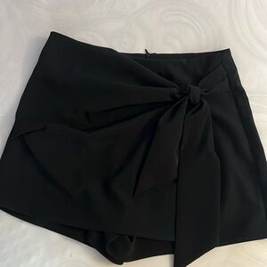 Beautiful black squirt can dress with running shoes or high heels